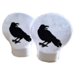 Set of two embroidered raven tealight covers in white felt, designed to fit over LED tealights, each featuring a black raven silhouette.