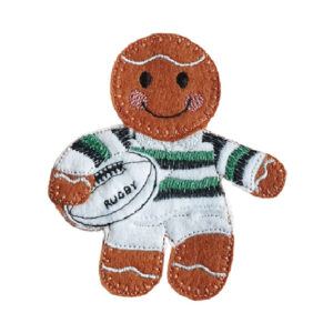 Handmade felt gingerbread character dressed as a rugby player, wearing a striped jersey and holding a rugby ball, with embroidered icing details and a smiling face.