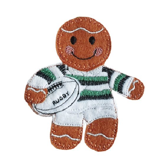 Handmade felt gingerbread character dressed as a rugby player, wearing a striped jersey and holding a rugby ball, with embroidered icing details and a smiling face.