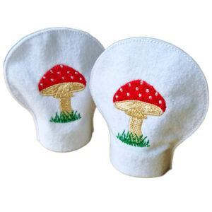 Set of two felt tealight covers featuring embroidered toadstool designs, shaped to fit over standard LED tealights.