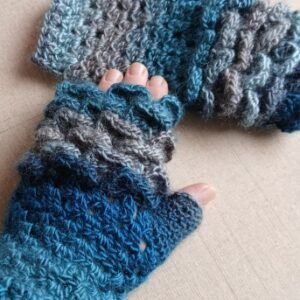 Pair of crocheted fingerless gloves in a dragon scales design.. All proceeds to The Stroke Association