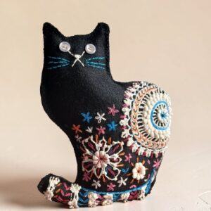 Made to order. Black cat decoration. Hand embroidered with vintage, crocheted lace fabric.Filled with lavender. All proceeds to The Stroke Association