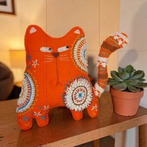 Made to order.Ginger cat decoration. Hand embroidered with vintage, crocheted lace fabric.Filled with lavender. All proceeds to The Stroke Association .