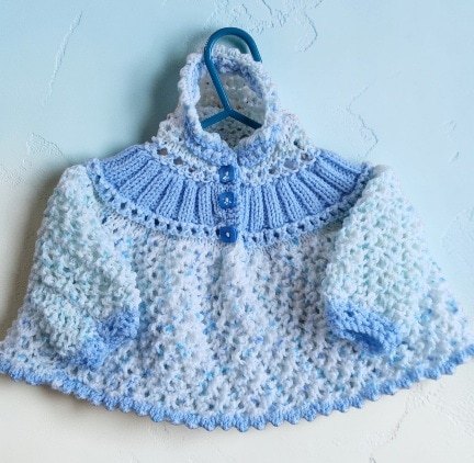 Hand-knitted baby jumper with hood. Approx 0 to 3 mths. All proceeds to The Stroke Association