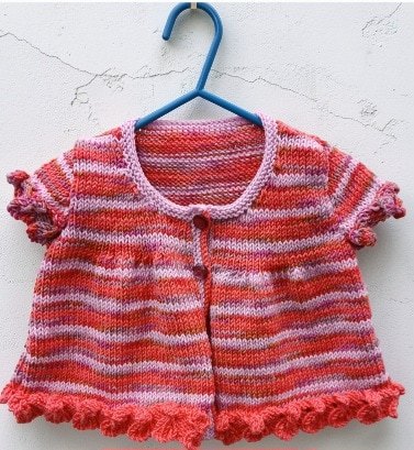 Hand- knitted sleeveless baby cardigan. Approx 6 to 9 mths. All proceeds to The Stroke Association