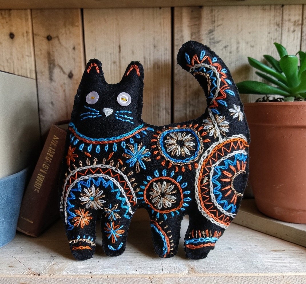 Made to order.Black cat decoration. Hand embroidered and filled with lavender. All proceeds to The Stroke Association