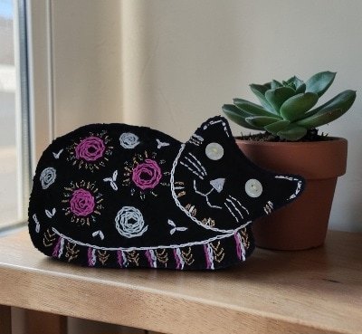 Made to order.Black cat decoration. Hand embroidered.Filled with lavender. All proceeds to The Stroke Association .