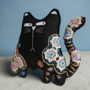 Made to order.Black cat decoration. Hand embroidered with vintage, crocheted lace fabric.Filled with lavender. All proceeds to The Stroke Association .