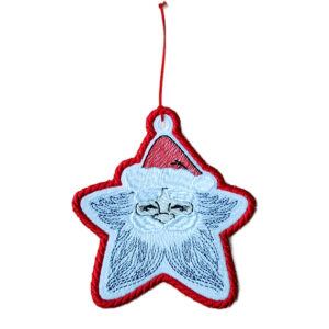 Handmade embroidered star-shaped Christmas ornament with a blue stitched Santa face design, red border, and red hanging thread loop.
