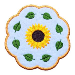 Sunflower candle coaster with scalloped edge, featuring a bright yellow sunflower and green leaves