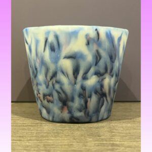 Handmade translucent polymer clay tealight holder with blue and ivory marbled pattern designed to glow softly when lit, mindfulness candle holder by Lollygag Gifts Sheffield