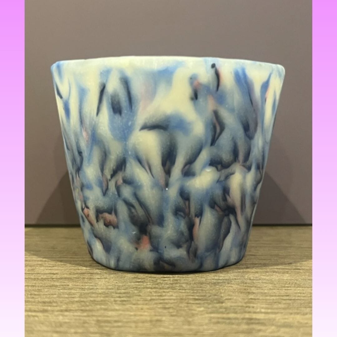 Handmade translucent polymer clay tealight holder with blue and ivory marbled pattern designed to glow softly when lit, mindfulness candle holder by Lollygag Gifts Sheffield