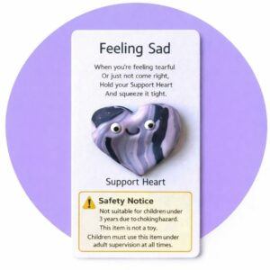 Handmade polymer clay Support Heart pocket keepsake on affirmation backing card reading “Feeling Sad” with visible safety warning stating not suitable for children under 3 years due to choking hazard and not a toy