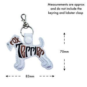 Embroidered Fox Terrier word art keyring in white faux leather with stitched dog silhouette design, shown with approximate size of 83mm wide and 70mm high (excluding keyring and clasp)