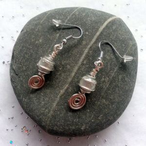 Handmade White Swirl Dangly Drop Earrings with Miracle Glow Beads - Elegant Wire Wrapped Artisan Jewellery