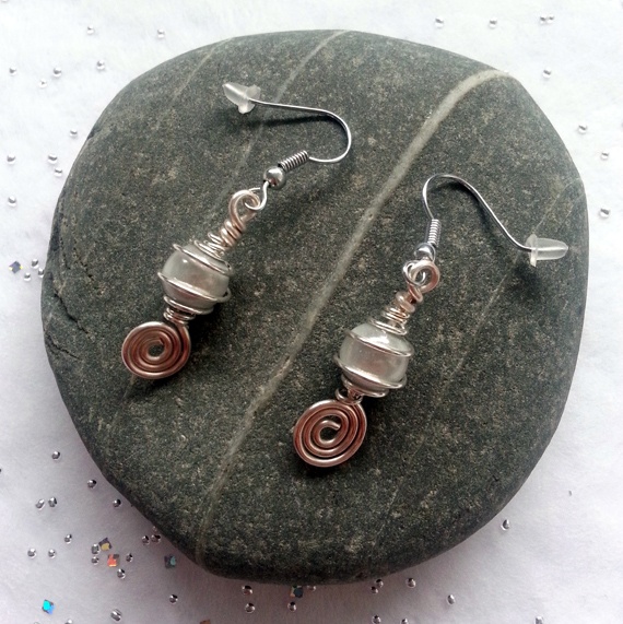 Handmade White Swirl Dangly Drop Earrings with Miracle Glow Beads - Elegant Wire Wrapped Artisan Jewellery