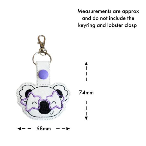 Koala face keyring with star glasses size guide, showing approximate measurements of 74mm high by 68mm wide.