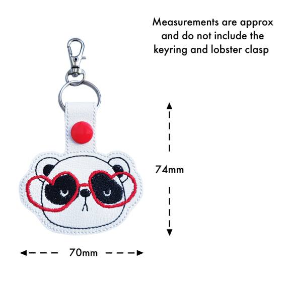 Panda face keyring with heart glasses size guide, showing approximate measurements of 74mm high by 70mm wide.