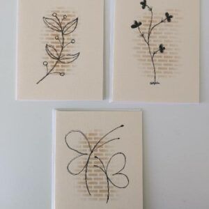 Pk 3 original cream coloured cards featuring handdrawn botanical illustrations on a stencilled brick wall