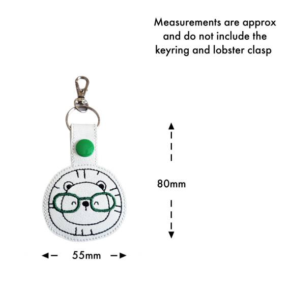 Lion face keyring with glasses size guide, showing approximate measurements of 80mm high by 55mm wide.