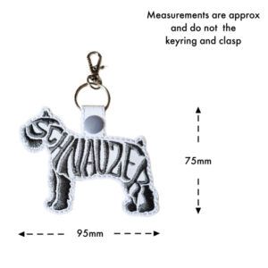 Embroidered Schnauzer word art keyring in white faux leather, featuring stitched dog silhouette design with approximate size of 95mm wide and 75mm high (excluding keyring and clasp)