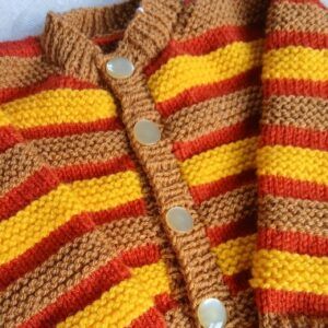 Hand knitted baby cardigan. Approx 6 to 12 mths.All proceeds to The Stroke Association