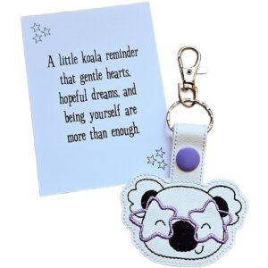 Take a piece of cuteness with you wherever you go!  The Starry-Eyed Koala with Glasses Keyring features a charming koala bear face adorned with stylish star-shaped glasses. A thoughtful gift for koala lovers, perfect for birthdays, Christmas, or a spontaneous ‘thinking of you’ surprise