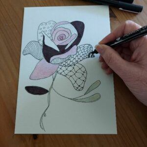 close up of hand drawing flower