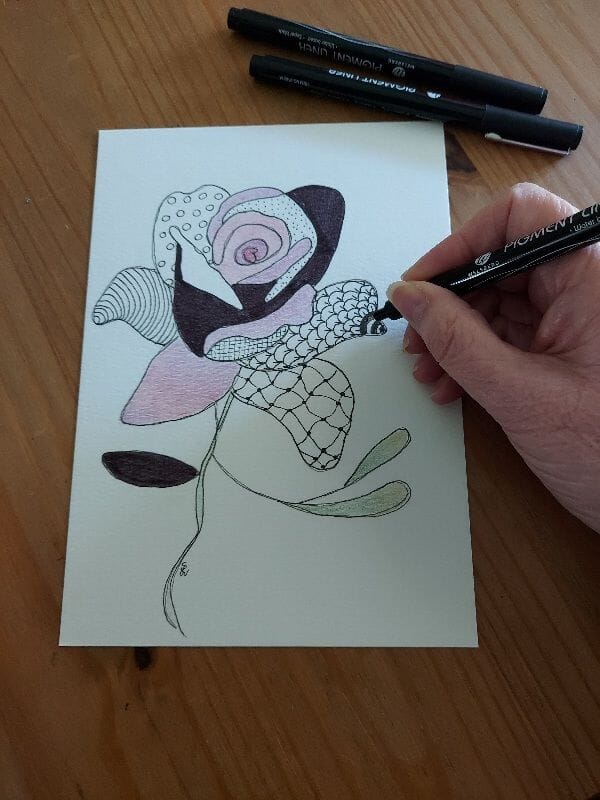 close up of hand drawing flower