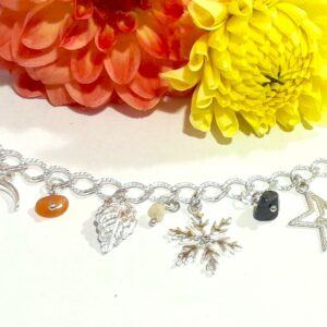 silver plated chakra charm bracelet with swarovski snowflake