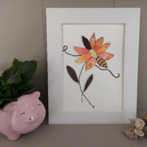 Framed mixed media floral illustration with patterned petals