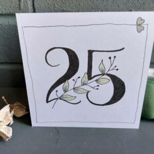 white 5"x5" card with bold 25 in centre and green leaf stem winding through, 2 silver hearts in top right corner