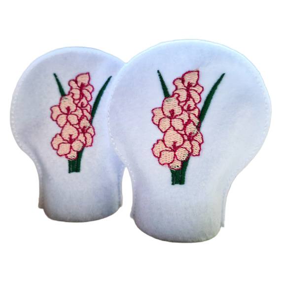 Unlit embroidered August birth flower tealight covers on white felt, with pink gladiolus blooms and green stems, designed to fit over battery operated LED tealights.