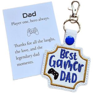 White faux leather Best Gamer Dad keyring with blue embroidery, gold border, gamer controller detail and keepsake card for Dad.