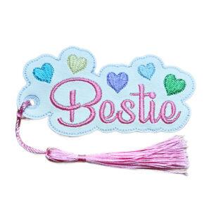 Embroidered 'Bestie' bookmark with colourful heart details, scalloped edging and a coordinating tassel, designed as a friendship gift for readers.