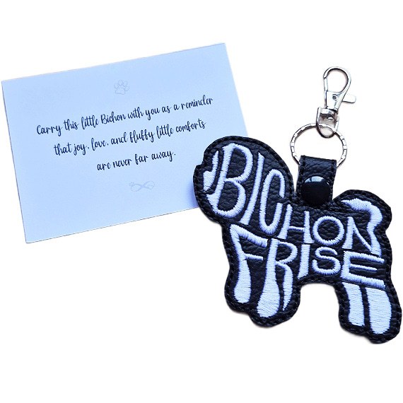 Black embroidered Bichon Frise word art keyring with silver clip and matching keepsake card for dog lovers.