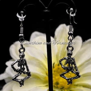 Silver tone dancing skeleton charm earrings