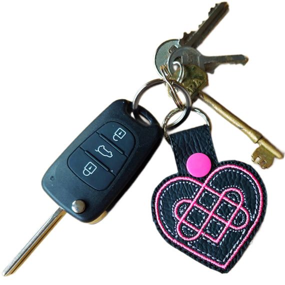 Black Celtic Heart keyring attached to a set of keys, showing its size and everyday use.