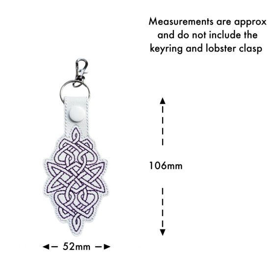 White Celtic Knot keyring with size guide showing approximate measurements of 106mm x 52mm, excluding the keyring and lobster clasp.
