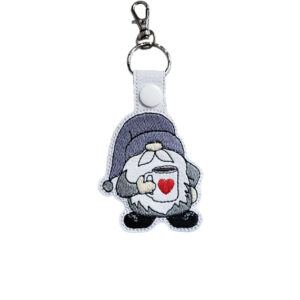 Embroidered coffee gnome keyring in faux leather, featuring a cosy gnome holding a cup with a heart and sturdy metal keyring hardware.