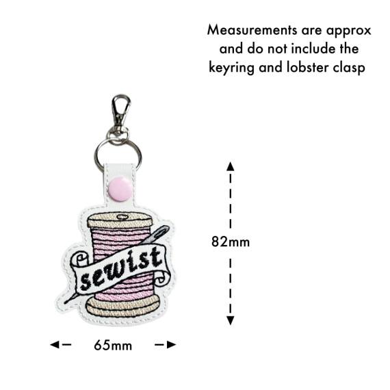 Size guide for a white faux leather Sewist keyring, measuring approximately 65mm by 82mm.