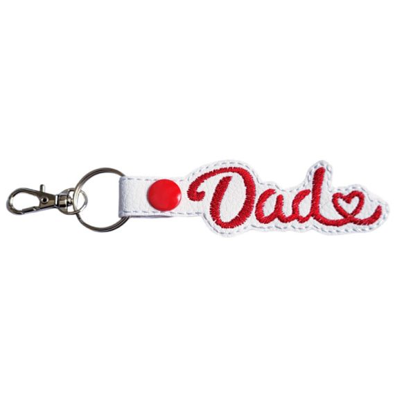 White faux leather Dad Heart keyring with red embroidered Dad lettering, heart detail and sturdy metal keyring hardware.