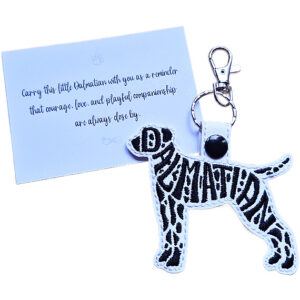 White embroidered Dalmatian word art keyring with black spotted details, silver clip and matching keepsake card for dog lovers.