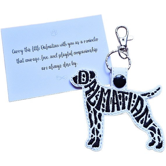 White embroidered Dalmatian word art keyring with black spotted details, silver clip and matching keepsake card for dog lovers.