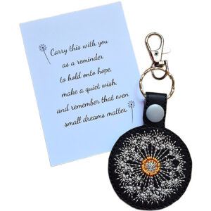 Black embroidered dandelion clock keyring with gold clip and matching keepsake card featuring a hopeful wish-themed message.