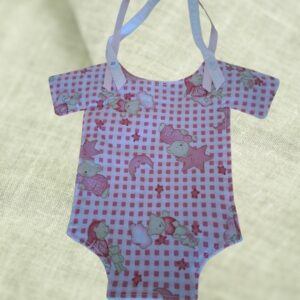 Decorative Nursery Item with two pink ribbon hangers one has a greeting "it's a girl"