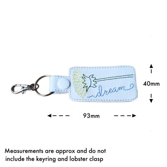 White embroidered dandelion dream keyring size guide showing approximate measurements of 40mm high by 93mm wide, excluding the keyring and lobster clasp.