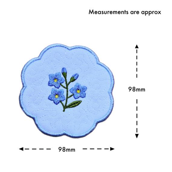 Forget me not candle coaster size guide showing the embroidered scalloped coaster measuring approximately 98mm by 98mm.