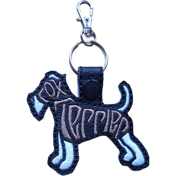 Black embroidered Fox Terrier word art keyring made from faux leather, with stitched breed lettering and silver metal hardware.