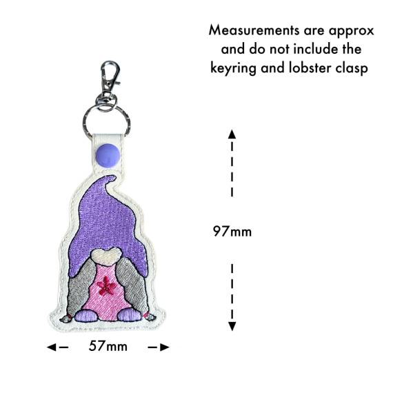 Embroidered girl gnome keyring with size guide showing approximate measurements of 97mm by 57mm excluding the keyring and lobster clasp.